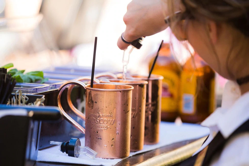 bartender making moscow mules